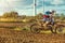 Extreme Motocross MX Rider riding on dirt track