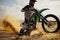 Extreme motocross rider riding on dirt track