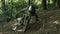 Extreme motorcyclist rides on the forest roads and fall. Motocross. Motosport