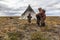 The extreme north, Yamal, the past of Nenets people, the dwelling of the peoples of the north, a children playing near the yurts i