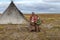 The extreme north, Yamal, the past of Nenets people, the dwelling of the peoples of the north, a family photo near the yurt in the