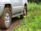 Extreme offroad behind car in mud