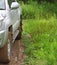 Extreme offroad behind car in mud