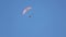 Extreme people go paragliding, flying high in blue sky, enjoying adventure sport