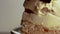 Extreme selective focus macro Close-Up Up View Of Salted caramel cheese cake dessert pastry against plain white background and a