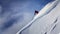 Extreme skier charging down steep slope