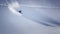 Extreme skier charging down steep slope