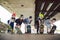 Extreme sport in city. Skateboarding Club for children. Group friends posing on ramp at skatepark. Early adolescence in skate