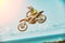 Extreme sports, motorcycle jumping. Motorcyclist makes an extreme jump against the sky. Extreme sports, motorcycle