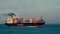 Extreme telephoto view of huge cargo ship approaching San Francisco Bay