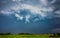 Extreme thunderstorm supercell with white hail core, hail falling on a village