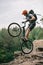 extreme trial biker standing on back wheel