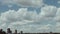 Extreme ultra wide view of the Toronto skyline on a day with puffy clouds.