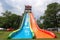 extreme water slide with steep drop and looping twists and turns