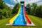 extreme water slide with steep drop and looping twists and turns
