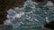 Extreme wave crushing coast outside closeup. Sea splashing by volcanic stones