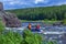 Extreme whitewater rafting trip. A group of people team in sport Ñatamarans practise traversing the water rapids of the