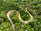 Extreme winding highway in the mountains passing trough a forest