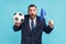 Extremely amazed man wearing dark suit holding in hands flag of europe union and football ball