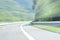 Extremely defocused and blurred image of a road in the countryside