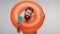 Extremely happy delighted bearded guy dancing inside big rubber ring and showing passport, celebrating trip