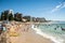 Extremely overcrowded Cronulla beach on Australia day. People relaxing, swimming and sunbathing on