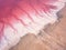 Extremely salty pink lake, aerial view, natural abstract background