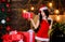Extremely sexy. sexy woman in santa hat. sensual girl in erotic lingerie. girl with red present box. happy new year