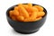 Extruded cheese puffs in a black ceramic bowl isolated on white