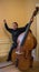 Exuberant excited Asian Musician with his Upright String Bass