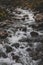 Exuberant water flowing in a stony stream on the plateau