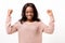 Exuberant young African woman cheering