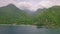 Exuisite view of tropical resort on lush green mountains near tranquil beach.