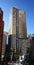 EY Centre, Syndey CBD, Australia. Modern bronze colored glass office tower with round corners in city commercial center.