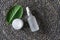 Eye care products eco natural extract concept, top view. Serum fluid dropper and moisturizer cream on raffia weave background