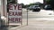 eye exam here writing text caption sandwich board sign in front of store