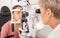 Eye exam, ophthalmologist and vision of woman, eyes or eye test with slit lamp or machine. Healthcare, eyesight and