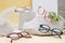 eye glasses on concrete podiums on a beige background, trend composition, stylish eye glasses on a beige background with