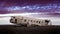 Eye-level shot of an old crashed military airplane in Iceland under the beautiful cloudy sky