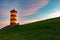 Eye-level shot of the Pilsum lighthouse in Germany during the sunset