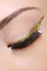 Eye make-up with golden arrow