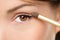 Eye makeup woman applying eyeshadow powder