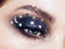 Eye makeup woman with decorative stars