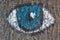 Eye painted on the bark of a tree