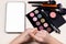 Eye shadow swatches on female hands. Colorful shadows best pigmentation. Decorative tones near blank white digital tablet screen