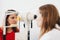 Eye test for visual acuity. The patient receives eye consultation.