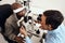 Eye, vision or sight test or exam of a patient above at an optometrist, optician or ophthalmologist. Testing and