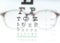 Eye vision test chart seen through eye glasses.