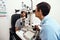 Eye and vision test, exam or screening with an optometrist, optician or ophthalmologist and a patient using an