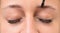 Eyebrow coloring young woman face close up